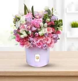 pink and white flowers in flower box